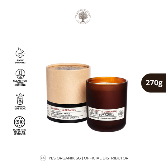 Brown candle with packaging and product details on a white background