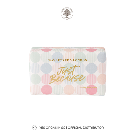 Soap bar with 'Just Because' text and colorful polka dot design on a white background